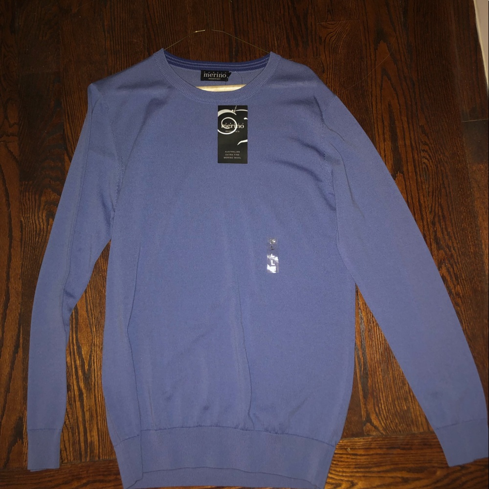 Merino wool blue sweater. Never worn. All tags and stickers still attached.
